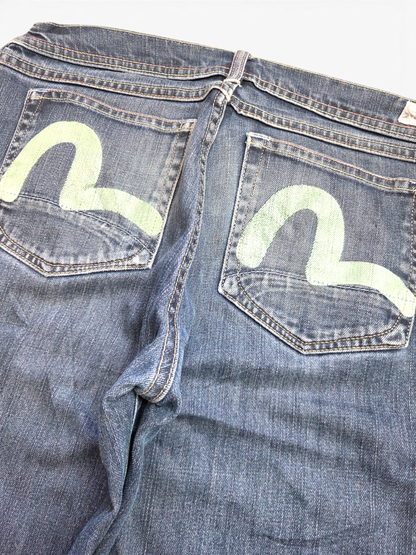 Evisu dark wash painted logo jeans, waistband and label detail