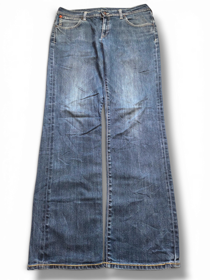 Evisu dark wash painted logo jeans, full length view